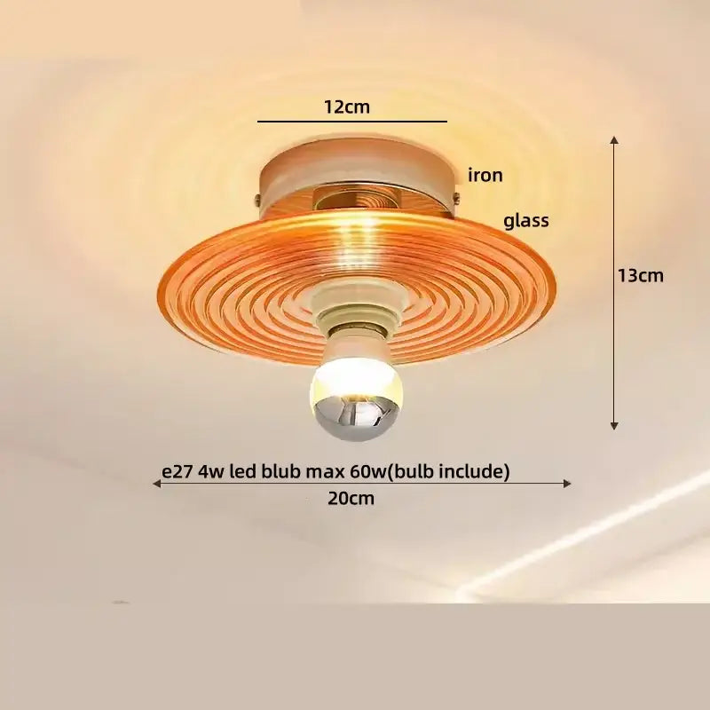 A warm-toned amber glass led ceiling light with concentric ridges and iron frame from decorbites japan style vintage wood luminaires