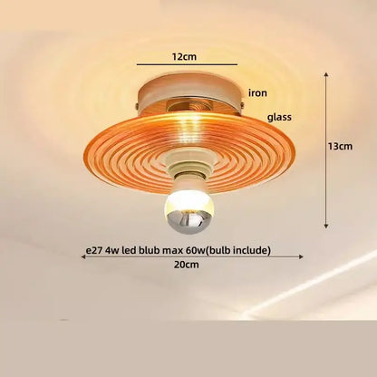 A warm-toned amber glass led ceiling light with concentric ridges and iron frame from decorbites japan style vintage wood luminaires