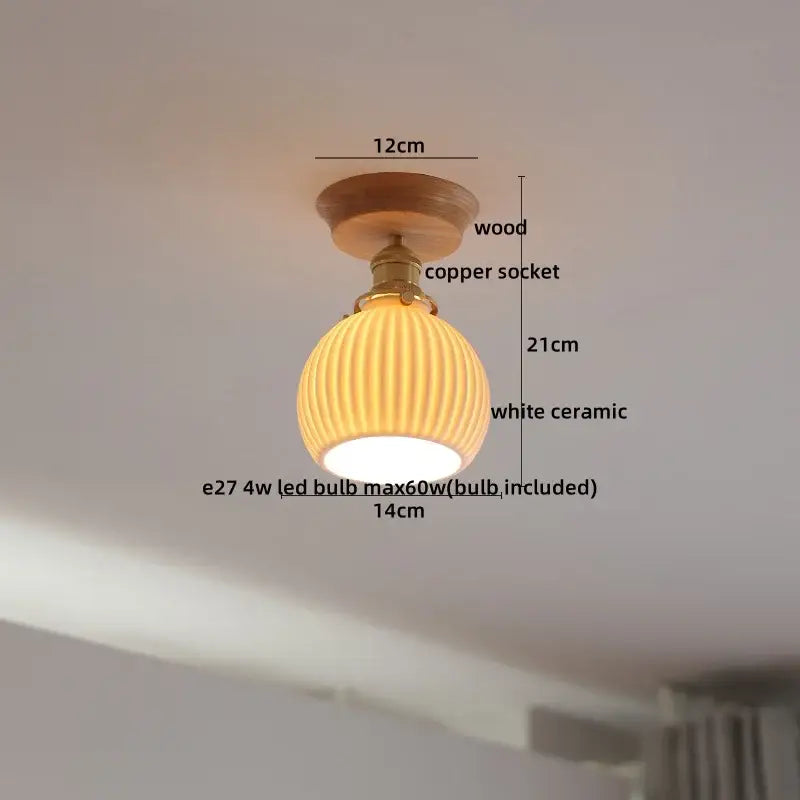 Warm-toned white ceramic pendant light with wooden mount and copper socket for modern amber glass led ceiling decor
