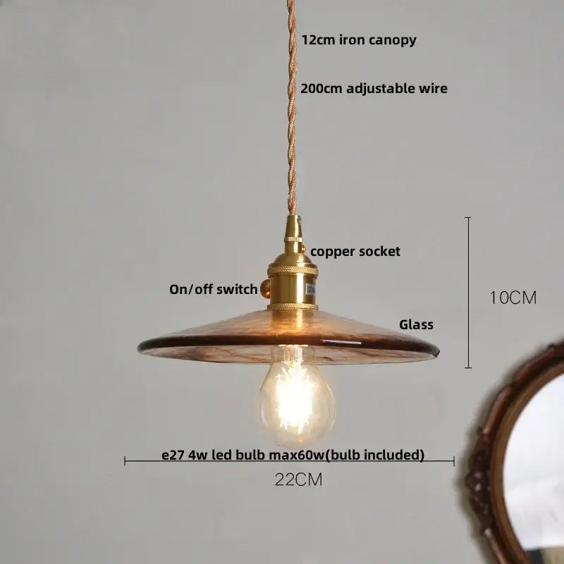 DecorBites amber glass pendant light fixture with warm amber glass, brass-finished copper socket, and adjustable braided wire suspension