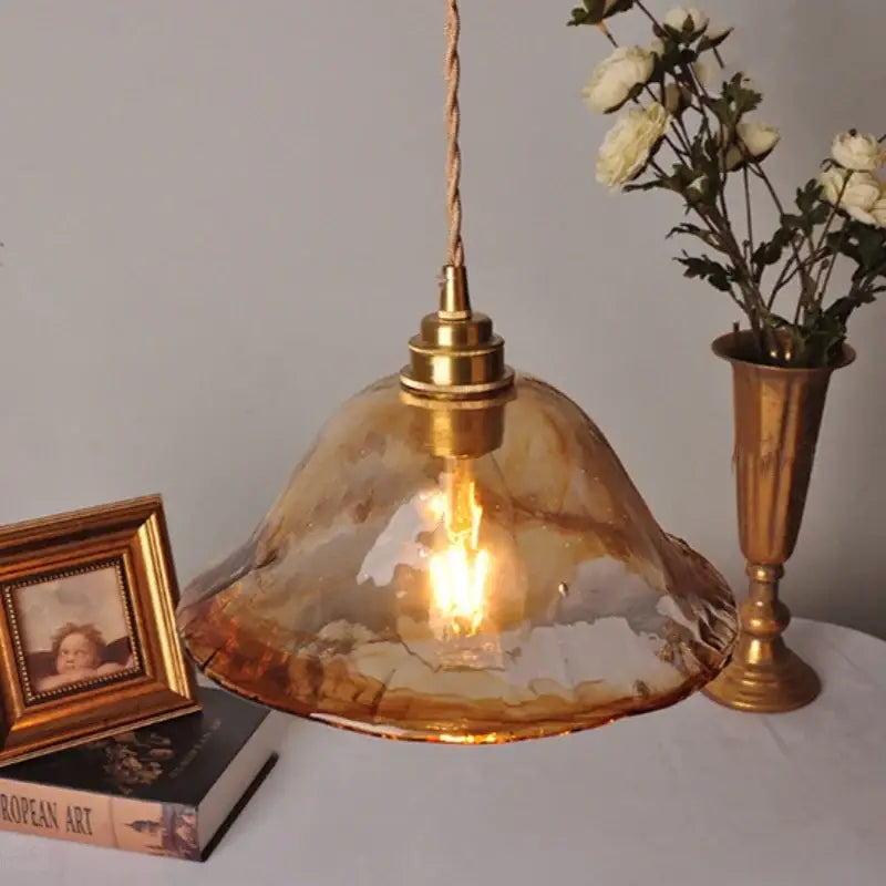 Decorbites amber glass pendant light fixture with warm amber hand-blown glass and brass-finished metal hanging lamp