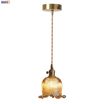 Decorbites amber glass led pendant light with golden brass and textured amber-tinted glass shade shaped like flower