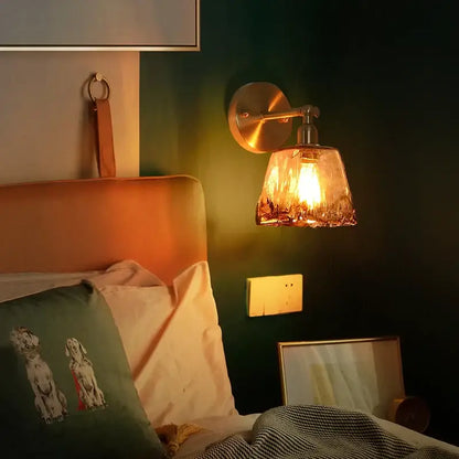 DecorBites amber glass led wall lamp with warm-toned brass and textured amber shade for minimalistic bedroom lighting