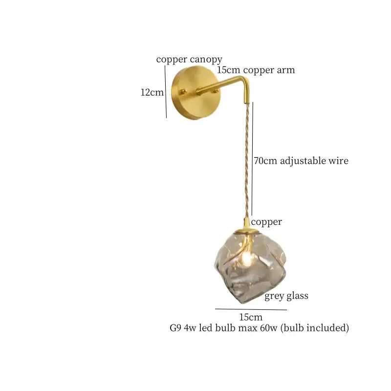 A modern DecorBites amber glass led wall light with a copper sconce and faceted grey glass shade with adjustable wire