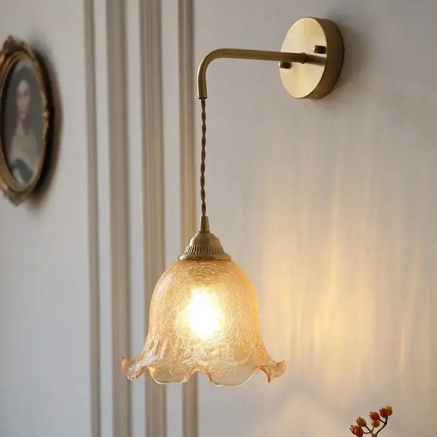 Decorbites amber glass led wall sconce with warm amber textured glass and brass chain for bedroom and bathroom use