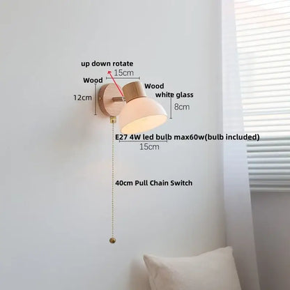 Minimalist decorbites amber glass wall sconce with natural wood base white shade and brass pull chain switch