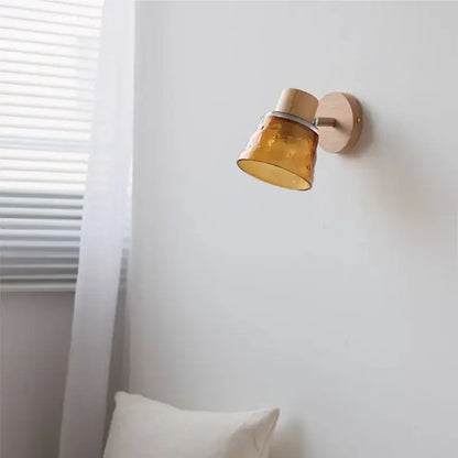 DecorBites amber glass led wall sconce with warm amber glass, wooden base and arm, textured finish, pull chain switch