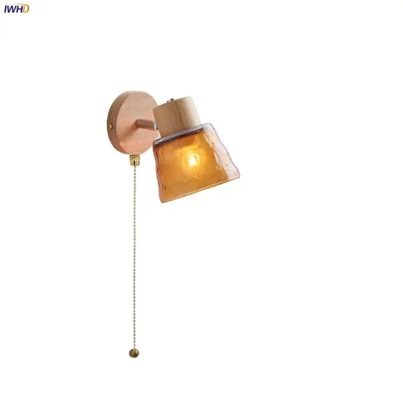 DecorBites amber glass led wall sconce with warm amber glass, wooden base, and brass pull chain for Nordic modern decor