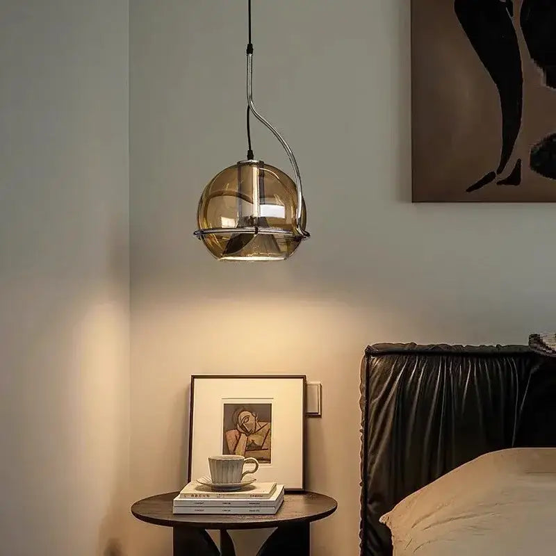 A decorbites amber glass pendant light with sleek amber-tinted glass and polished chrome frame for kitchen or hallway lighting