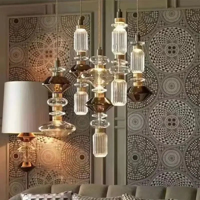 Modern pendant light with clear and dark amber glass shades and brass fittings by DecorBites amber glass