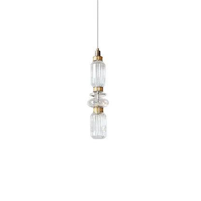 Decorbites amber glass pendant light with clear glass and gold-toned metal accents for hotel bedroom and bar use