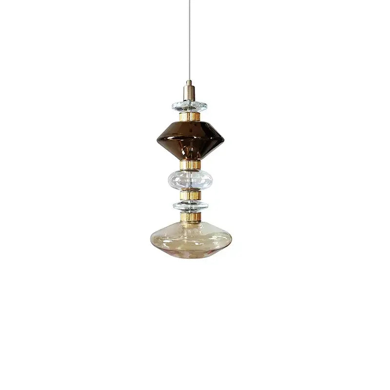 Decorbites amber glass pendant light with stacked amber clear and dark brown glass orbs and gold-toned accents for hotel decor