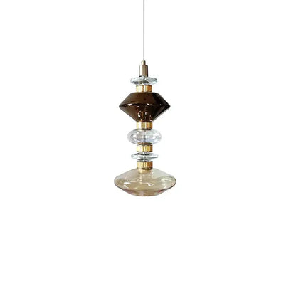 Decorbites amber glass pendant light with stacked amber clear and dark brown glass orbs and gold-toned accents for hotel decor