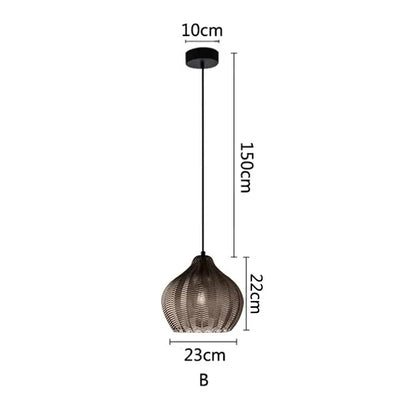 A modern black decorbites amber glass pendant light with woven textured glass shade and sleek metal chain for kitchens
