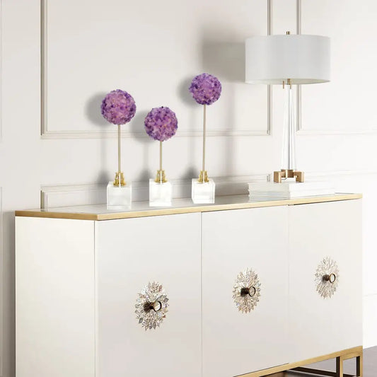 Decorbites amethyst flower metal sculpture features three elegant purple hydrangea pom-poms on gold stems in white marble bases
