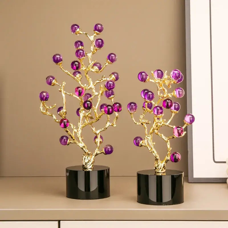 Two golden amethyst tree metal grapevine statues with purple glass orbs on black bases for elegant home decor