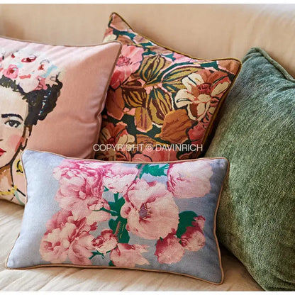 Rectangular cushion covers with pink floral pattern on light blue velvet featuring ancient art vintage revival design