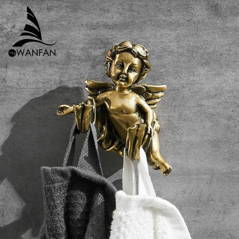 Golden angel brass towel hook with detailed wings and curly hair in metallic finish for bathroom or garage wall mounted use