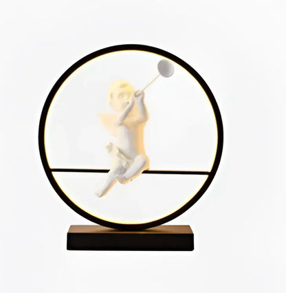 Decorbites angel doll bird table lamp with a white cherub figurine holding a tennis racket in a black frame