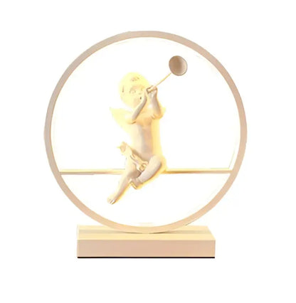 Golden cherub figurine encased in a circular frame with wooden base decorates the decorbites angel doll bird table lamp
