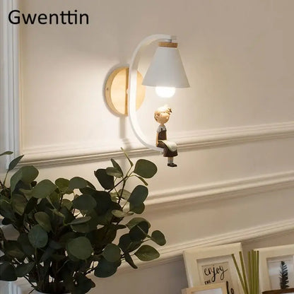 DecorBites™ angel girl bedroom wall sconces with white conical lampshade on curved wooden arm and child figurine