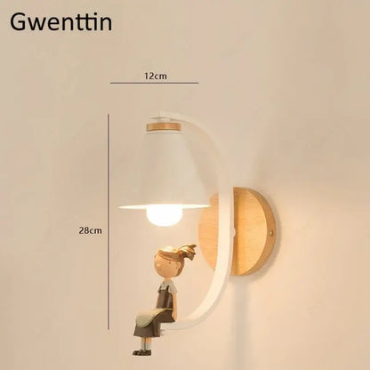 White and light wood decorbites™ angel girl bedroom wall sconces with curved arm and conical shade featuring girl figurine