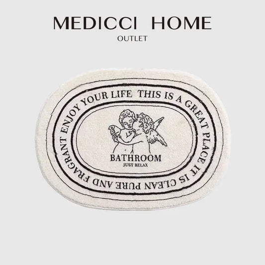 Cream-colored decorbites angel print shaggy bath rug 40x60cm with black embroidered cherubs and relaxing text design