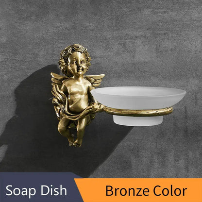 Decorbites™ angel style gold soap dish holder features a bronze angel figurine with a white ceramic bowl for bathroom wall mounting