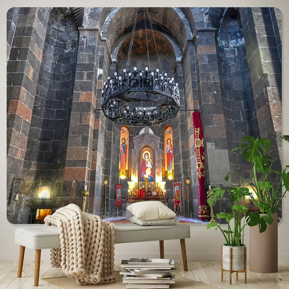 A black wrought iron chandelier with ornate detailing and candle-like lights complements boho wall decor in angel tapestry settings