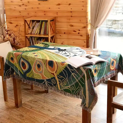 DecorBites™ animal pattern throw blanket with vibrant green and blue peacock feather pattern and fringed edges