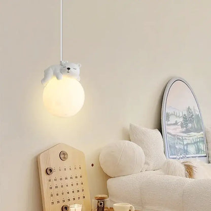 White polar bear-shaped resin pendant lamp with soft glowing spherical bulb for children’s room lighting decorbites pendant lamps