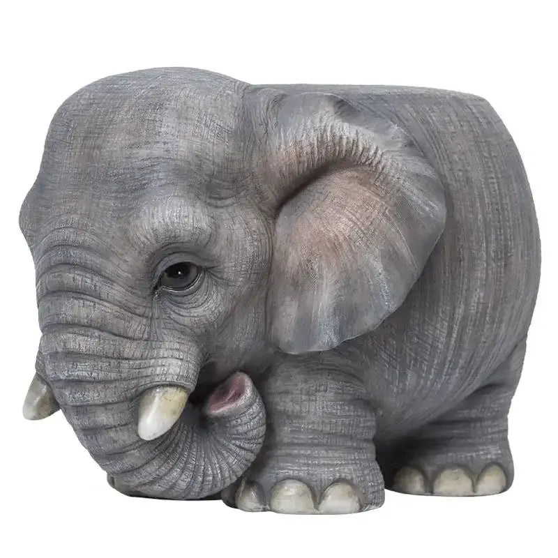Gray elephant resin sculpture footstool seat with detailed textured skin small tusks and pink inner ear by DecorBites