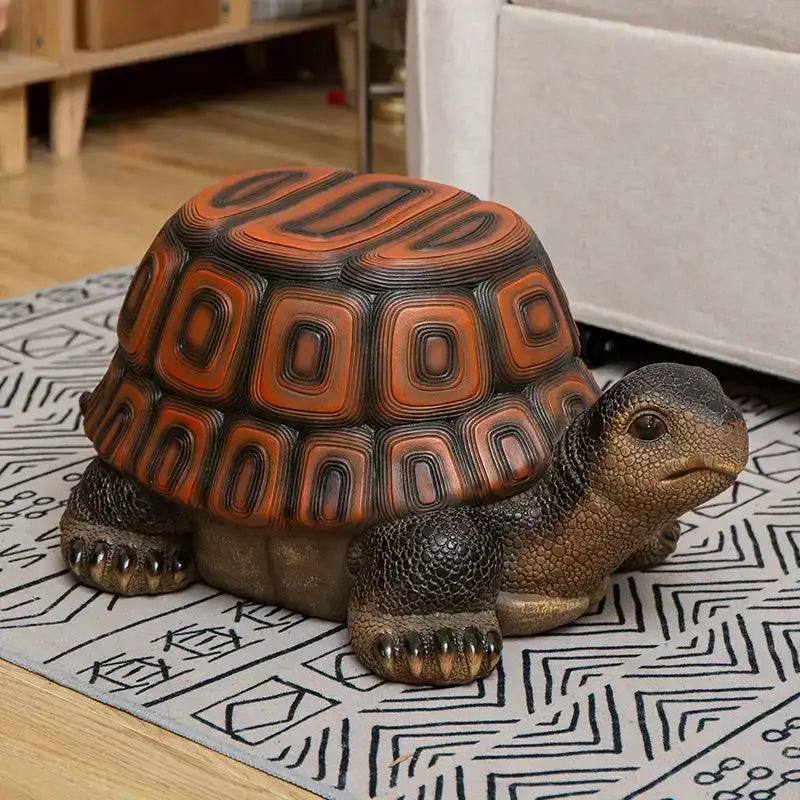 DecorBites™ sculpture footstool seat featuring a lifelike tortoise figurine with glossy orange black shell and textured resin skin