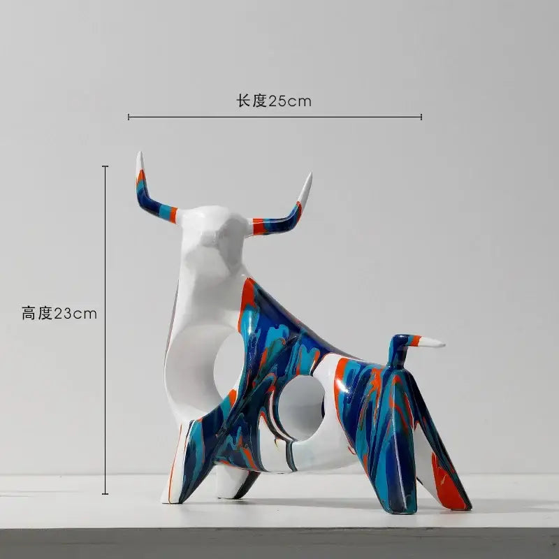 A modern abstract bull resin statue with glossy white base and vibrant blue orange teal marbled patterns from DecorBites animal resin collection