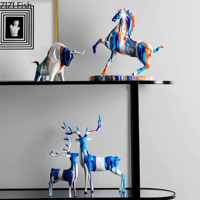 Vibrant blue white and orange abstract painted ceramic animal resin statues from the decorbites resin statue collection