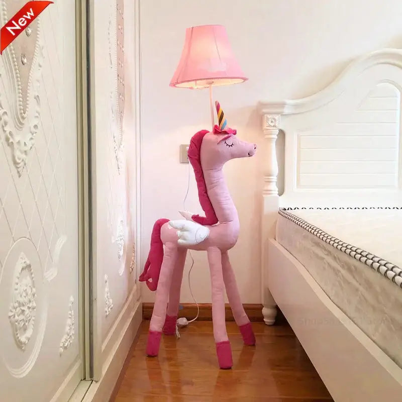Pink plush unicorn animal shape led floor lamp with rainbow horn and closed eyes for children’s room decor by DecorBites™