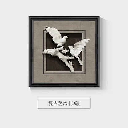 White sculptural animal wall decor with two doves and blossoms in a sleek black wall decor frame set by DecorBites™
