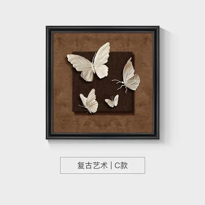 A decorbites™ animal wall decor frame set featuring three-dimensional white butterflies on a textured brown background