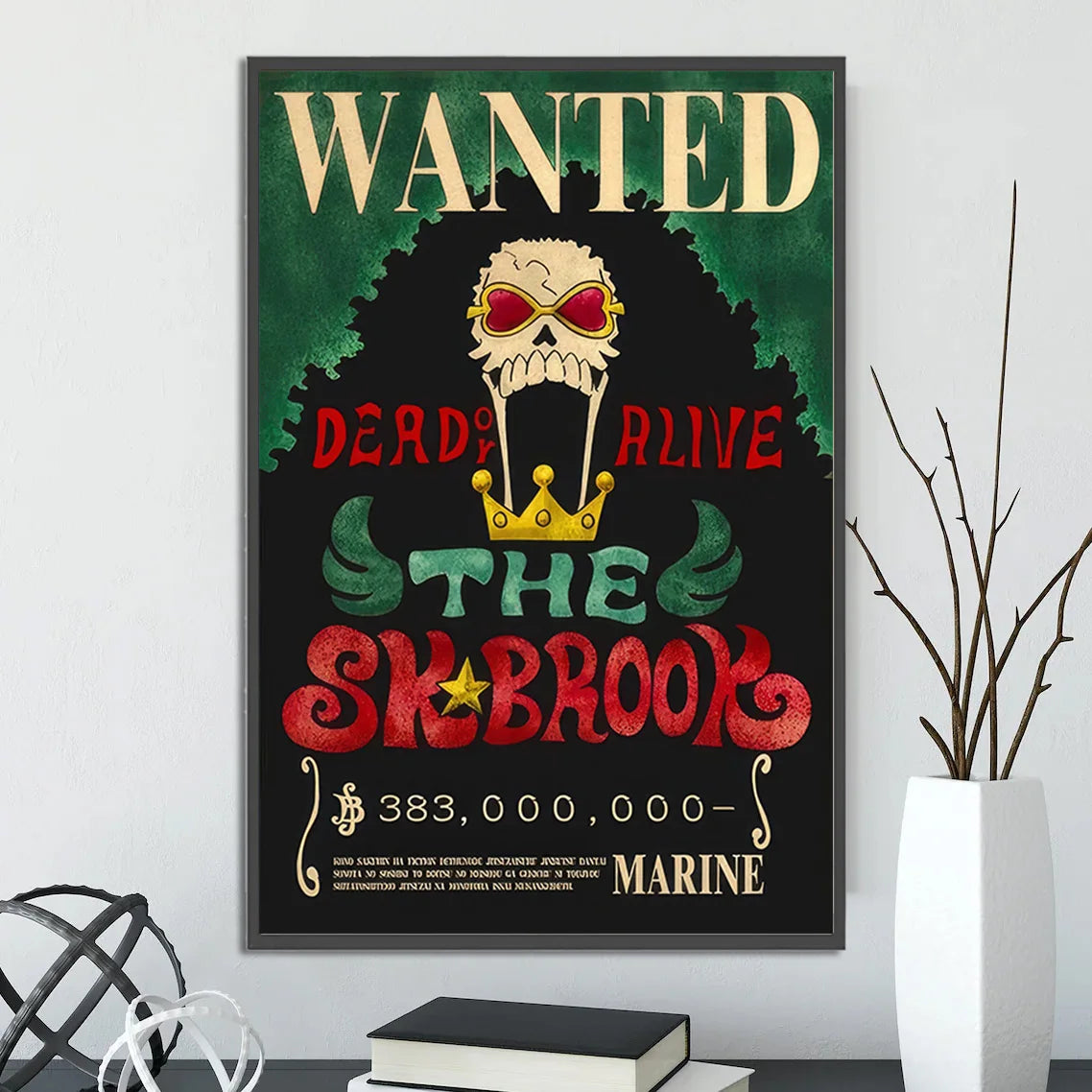 A framed decorbites™ anime one piece poster featuring a skull with red sunglasses and gold crown wall art piece poster set