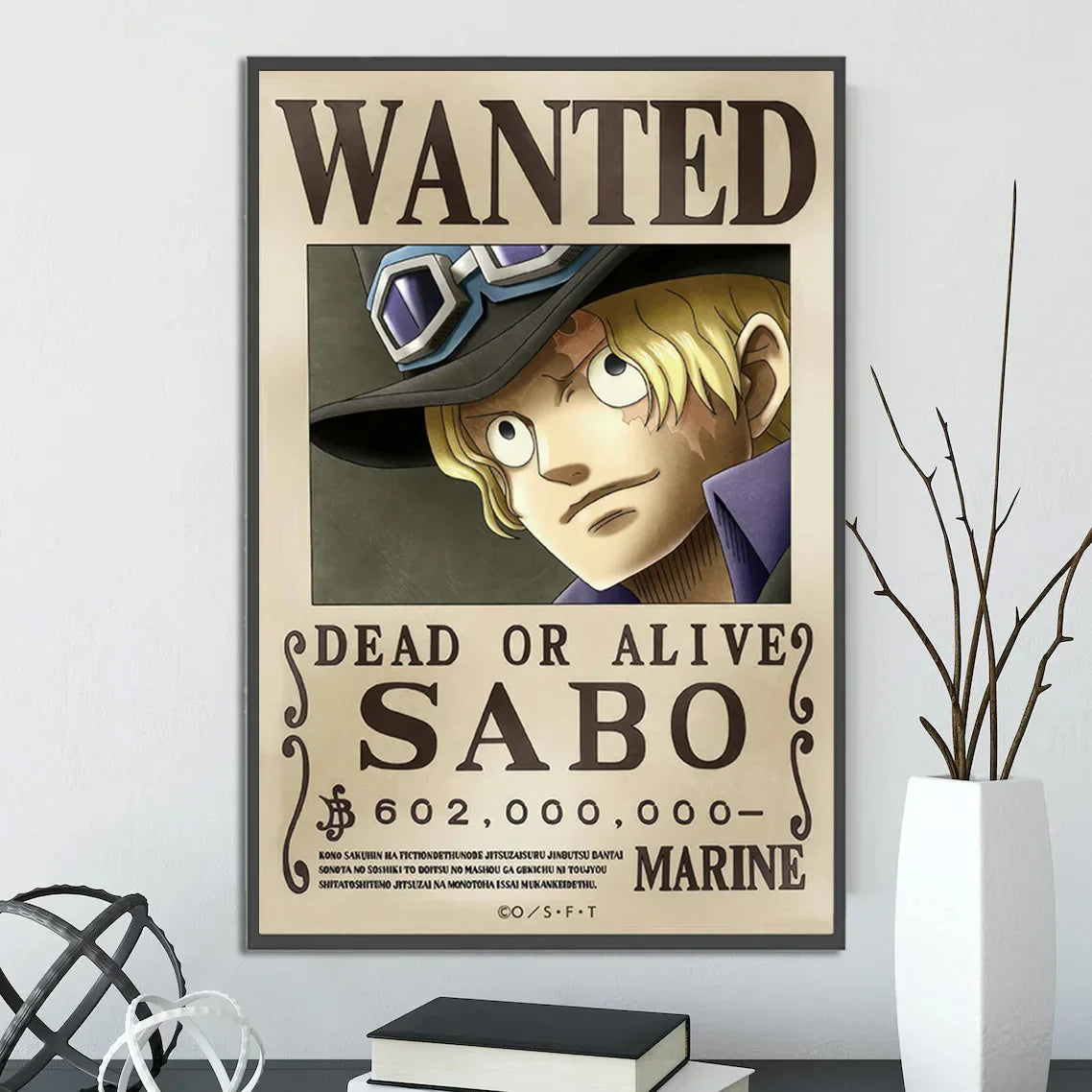 A framed DecorBites™ anime one piece poster featuring a wanted notice of sabo with bold black text wall art