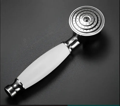A decorbites antique bathroom handheld shower head with sleek chrome finish white ceramic handle and circular spray face