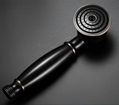 Black matte DecorBites antique bathroom handheld shower head with circular spray face and metallic accents for high pressure use