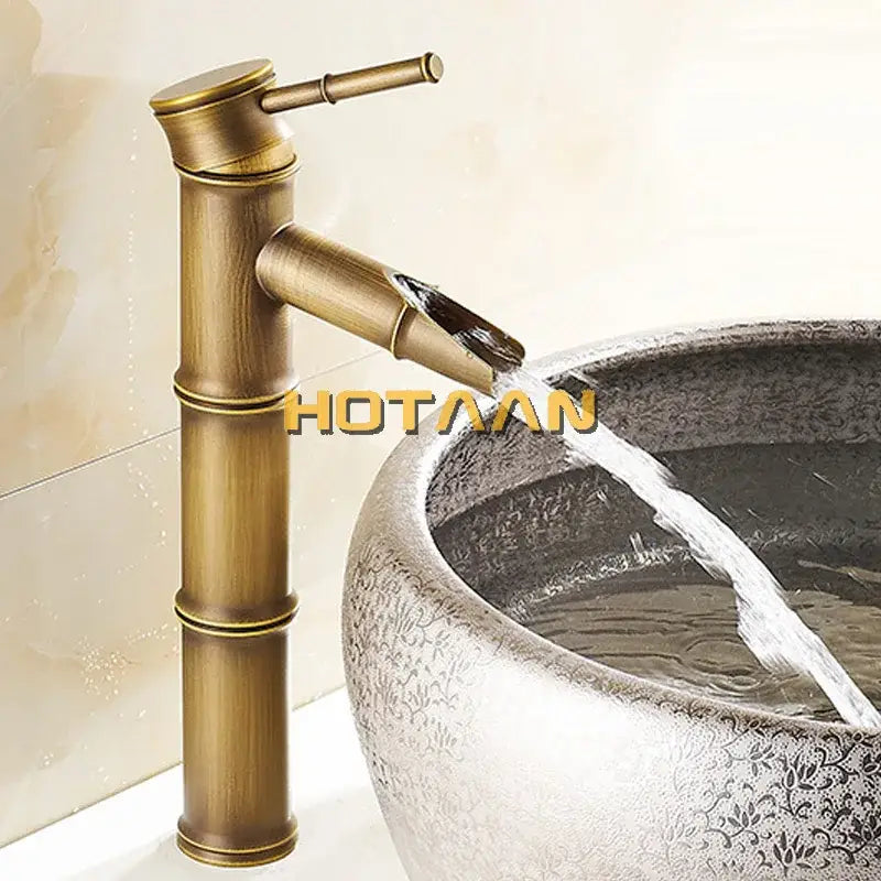 Decorbites antique brass basin faucet with bamboo style single handle and antique brass waterfall spout in vintage bronze finish