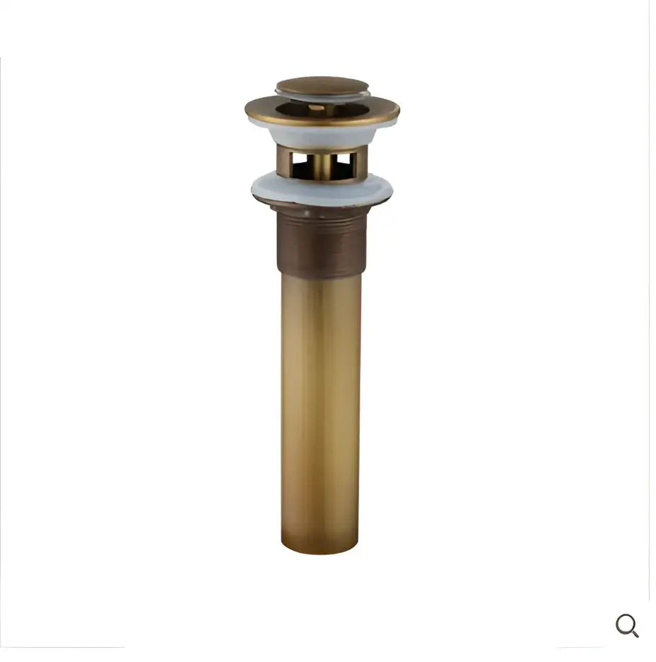 Brass-colored antique brass basin sink drain with a sleek cylindrical body and circular top cap for basin sink use
