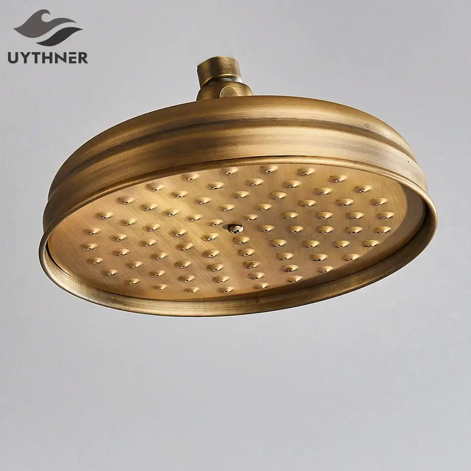 Brass-finished antique brass bath rainfall shower head with hammered texture and evenly spaced nozzles by decorbites