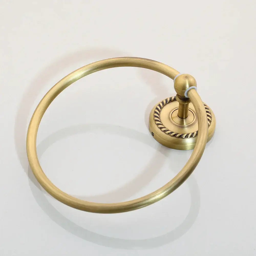 Antique brass bathroom towel ring with rope-twist base and smooth hoop from decorbites hardware set