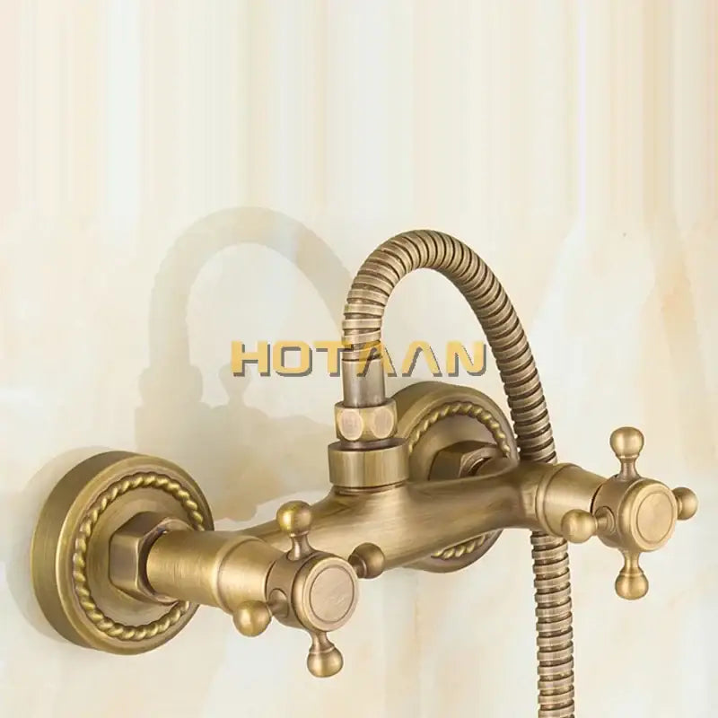 Decorbites antique brass bathroom wall-mounted basin tap set with ornate twisted rope detailing and two cross-handle knobs