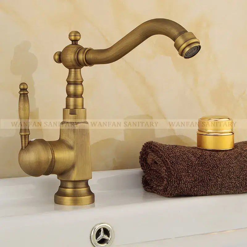 Decorbites antique brass bathroom sink faucet with ornate detailing swivel spout single handle mixer tap