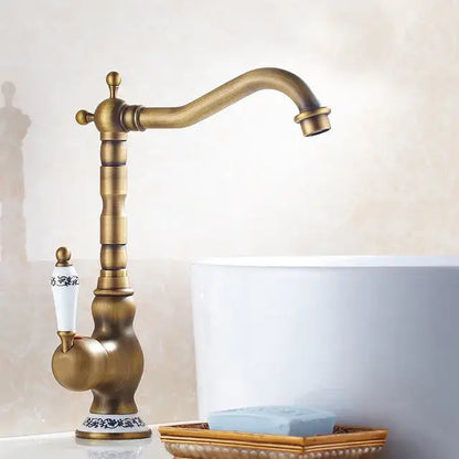 DecorBites™ antique brass basin faucet with antique brass ceramic white handle and blue floral detailing for kitchen sink