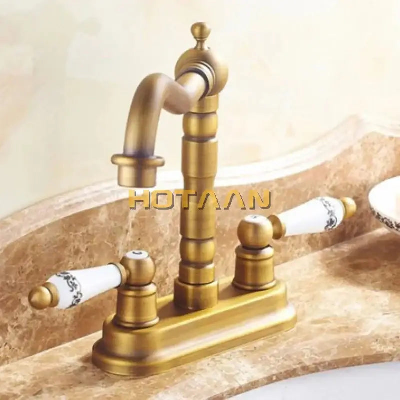 Decorbites antique brass dual hole basin faucet mixer tap with ornate segmented spout and ceramic floral handles